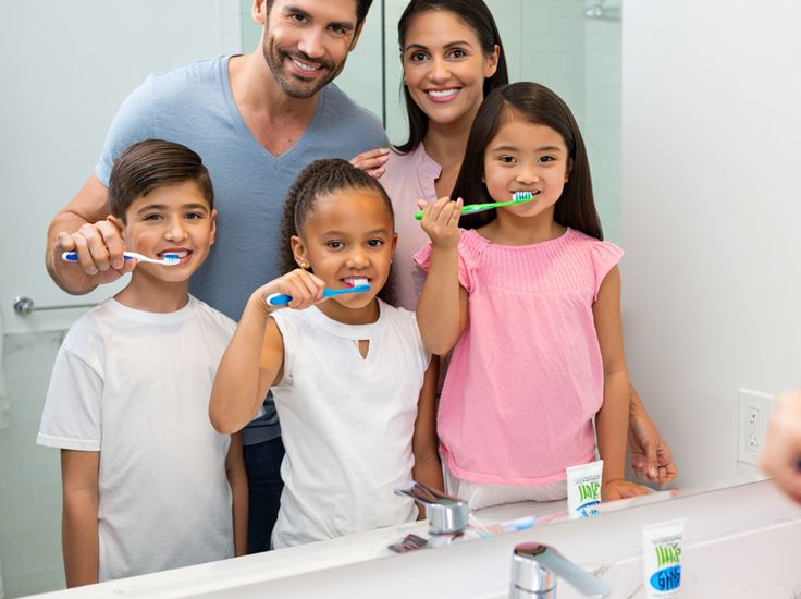 Happy family dental checkup for cavity prevention at Jireh Dental Group.