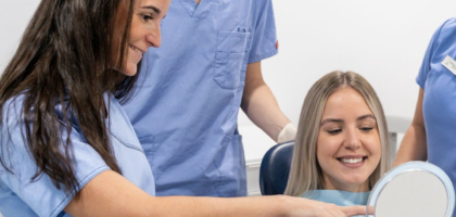 Dentist explaining the connection between oral health and overall wellness.