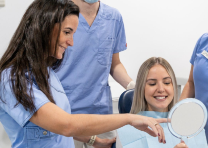 Dentist explaining the connection between oral health and overall wellness.